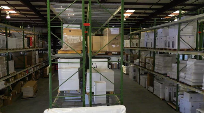 Warehouse aisles stacked with inventory at our Humble location