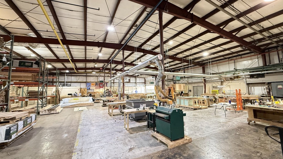 Our workshop floor, with lumber racks, workbenches and woodworking machines